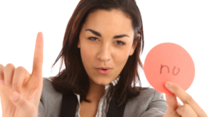 woman holding a sign saying no