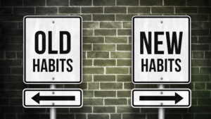 two signs reading old and new habits