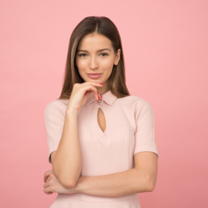 woman standing with pink shirt