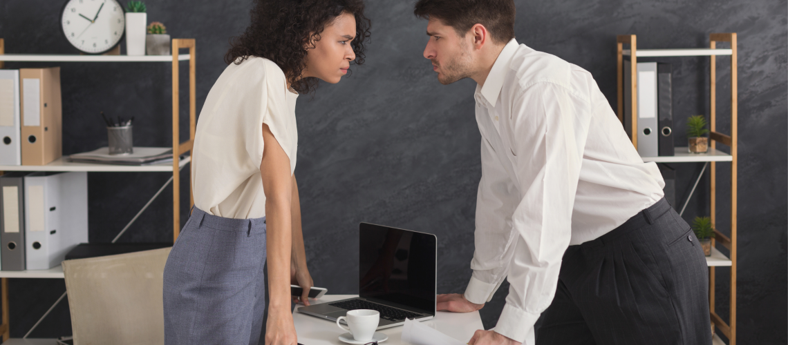 two people staring down at each other, workplace conflict