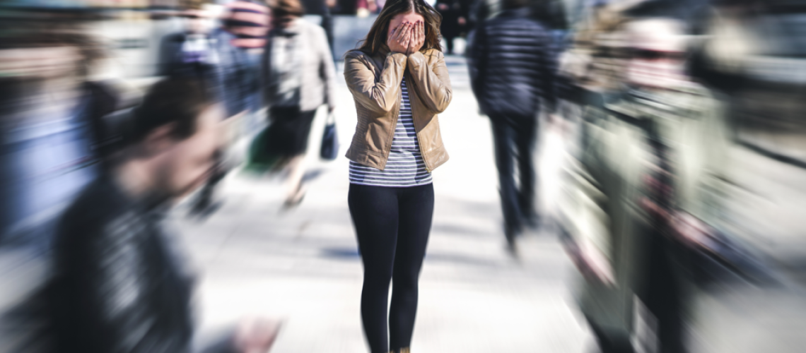 women covering face with hands