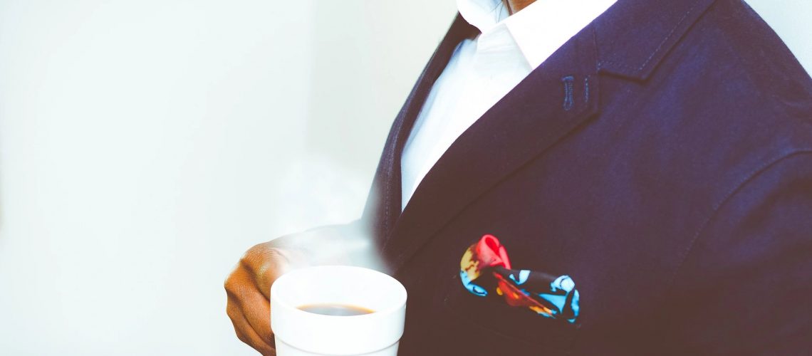 Career man hold a cup of coffee