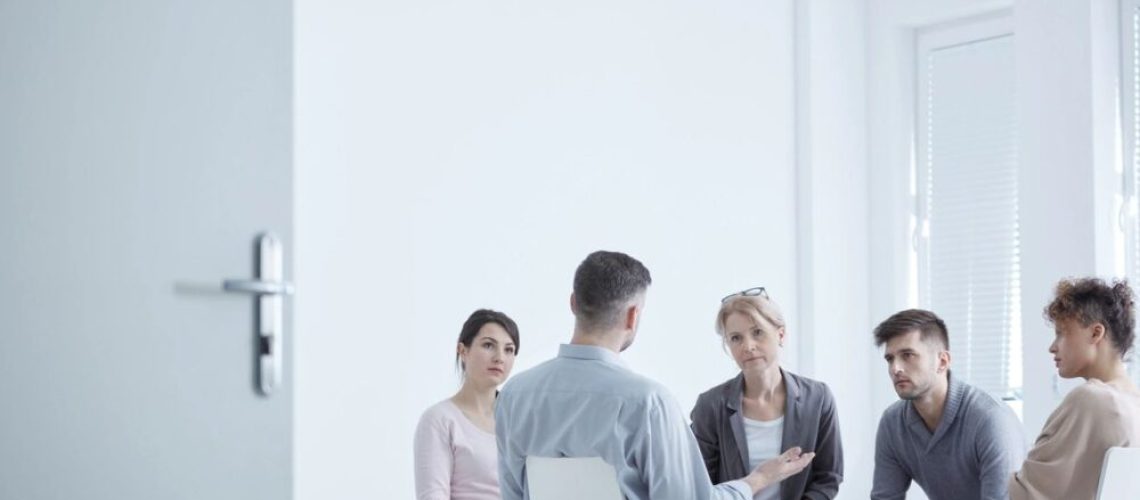 group of people sitting in a circle